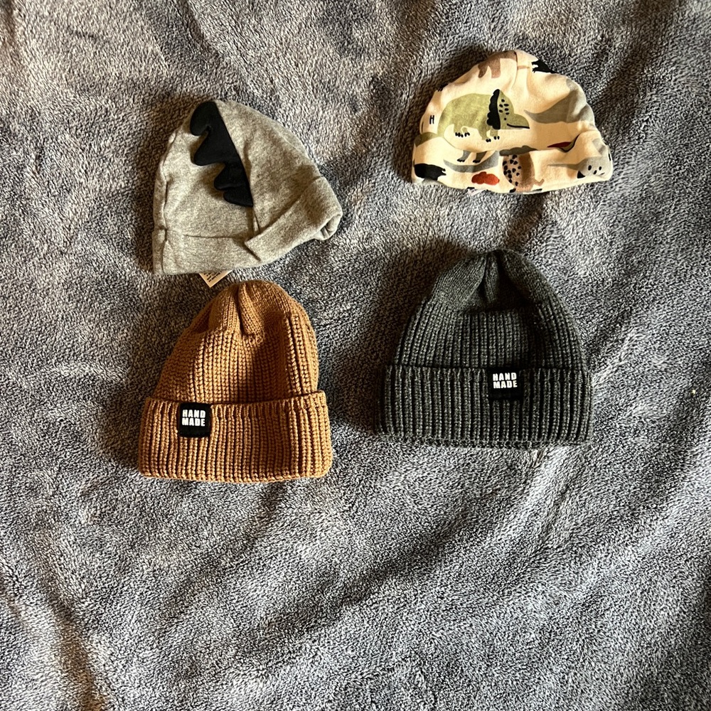 12 baby beanies and 1 blanket toy